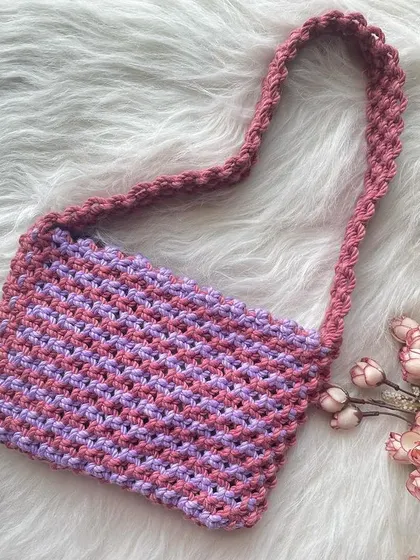 The same shoulder bag design, shown here in a lovely combination of lavender and light pink. All my designs can be customized with your favorite colors.