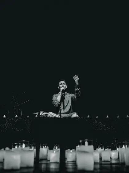 Leading a meditation with the audience in Ahmedabad. My concerts always include interactive elements like breathwork to unify the room and deepen the mental health experience.