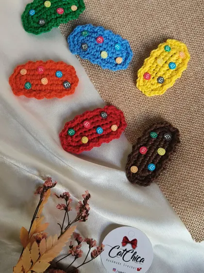 A close-up of our Girly Gems clips, showing the "M&M" like details on the crochet base.