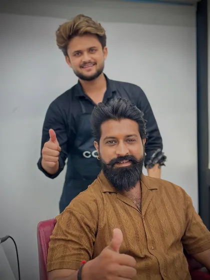 Two thumbs up from a happy client and his stylist. We love seeing our clients leave with a smile.