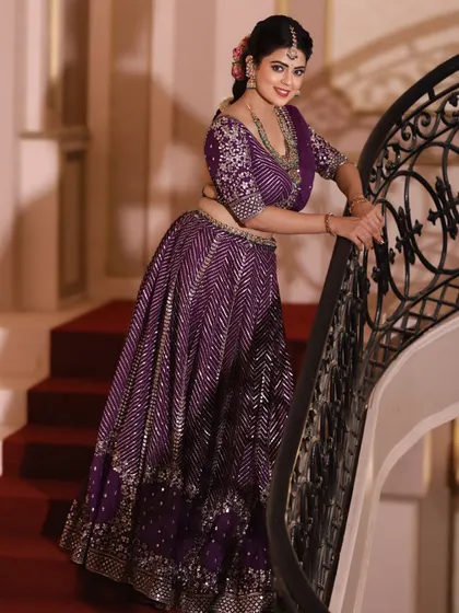 The grandeur of the lehenga is evident in this shot on the staircase.