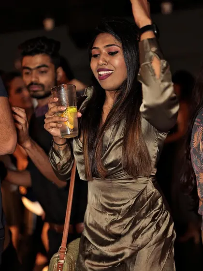 A guest enjoying a drink and the music, a perfect snapshot of a great night out.