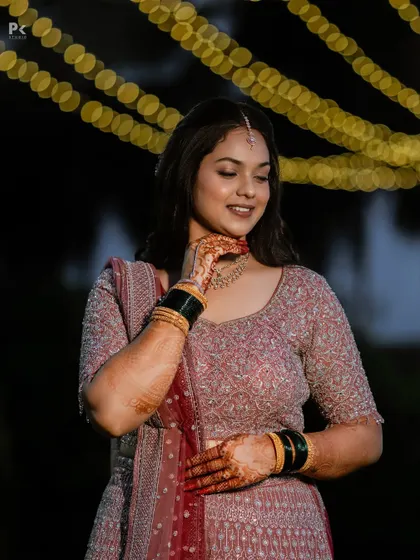 A beautiful candid photo of the bride. The minimal makeup enhances her features without feeling heavy, perfect for a long night of celebrations.
