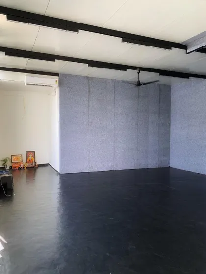 The corner of our studio, a quiet space for reflection before and after class, with our sound system and a small altar.