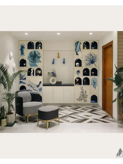 The completed study area, where the hand-painted bookshelf serves as the main feature. The design is complemented by a houndstooth accent chair, geometric flooring, and indoor plants.
