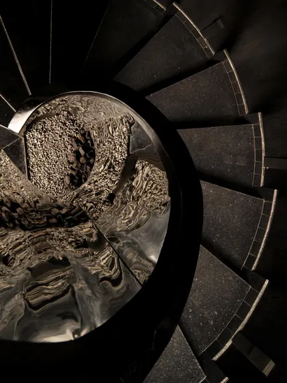 A collection of atmospheric shots from Lair, showcasing the interplay of black concrete, glass blocks, polished steel, and dramatic lighting. Each image captures a fragment of the bar's mysterious and immersive character.