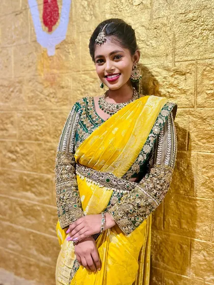 A smiling portrait of the model.