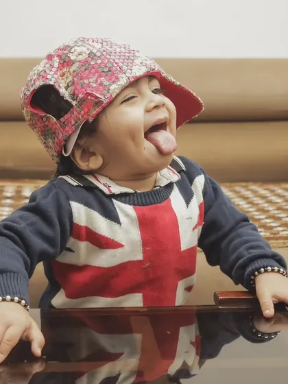 I love letting kids be themselves during a shoot. This playful, cheeky expression is a perfect example of the authentic moments I aim to capture instead of stiff poses.