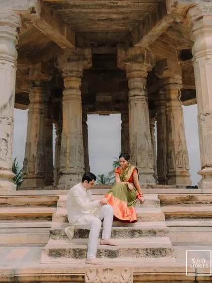 A quiet, intimate moment shared between a couple amidst the grandeur of a historic temple in Karnataka. This showcases my work in heritage destination weddings, blending love with timeless architecture.