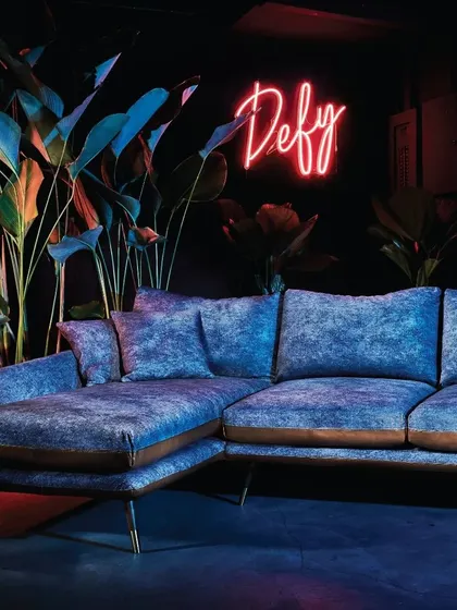 The Volta sectional sofa in a dramatic blue, showcasing its sharp lines and luxurious texture. This piece is a testament to the collection's blend of edgy modernity and sophisticated comfort, perfect for a contemporary living room.
