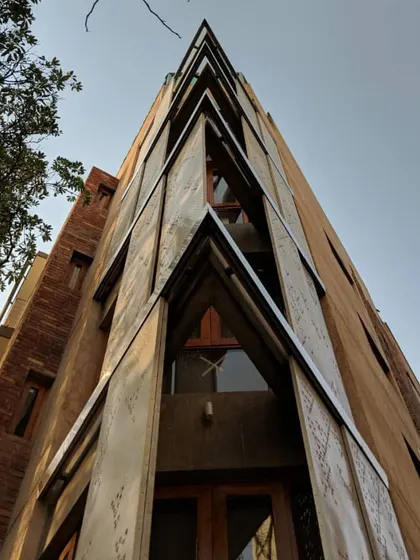 This is a close-up of the movable perforated metal screens on our Defence Colony residence. The design allows them to slide, giving residents control over sunlight and privacy. This is a modern interpretation of the traditional jaali, a key element of passive cooling design.