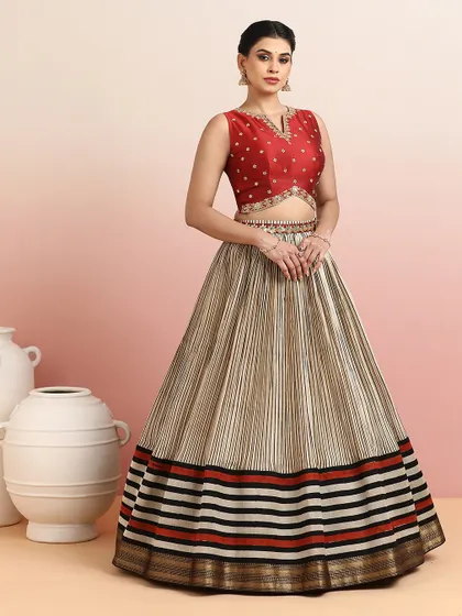 The full view of the striped lehenga, showcasing its unique pattern and modern silhouette.