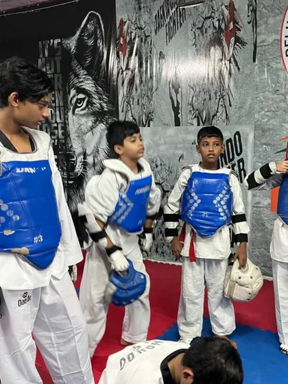 My students getting ready for a sparring session. Teamwork and focus are just as important as individual skill.