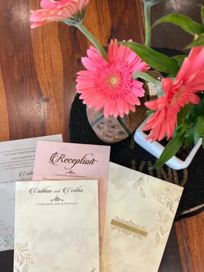 A complete invitation set with a soft, floral design. This image shows the main card along with matching inserts for different functions like the Reception.