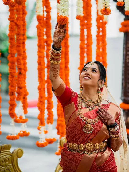 Another lovely shot with the marigold decor, her makeup looking perfect.