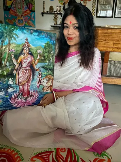 Me with my acrylic painting of Goddess Lakshmi, created for Kojagori Lokkhi Pujo. It's a special feeling to connect with my Bengali roots through art, especially during festivals.