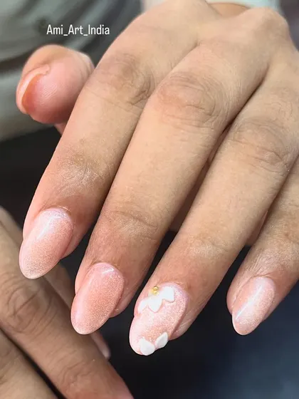 A simple but elegant 3D flower on a shimmery base. This shows how a small dimensional element can elevate the entire look.
