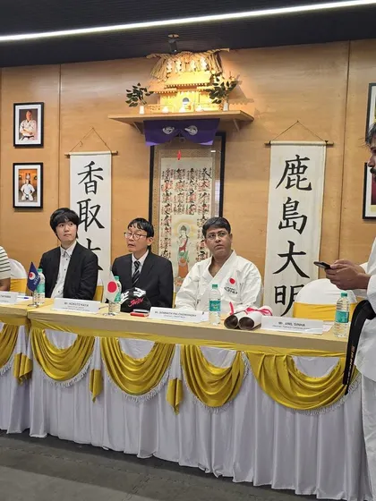 An instructor addresses the attendees and honored guests during the JKA seminar. These events are a platform for sharing knowledge and celebrating our students' progress.