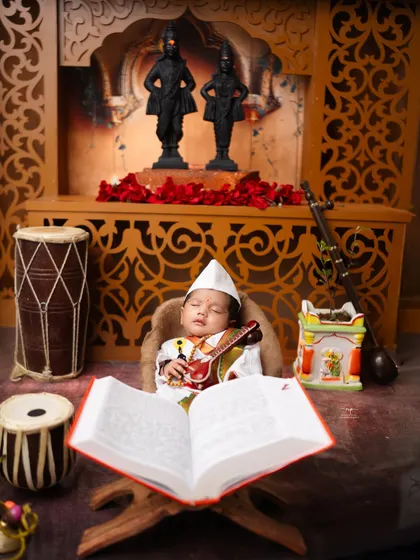 The full Varkari setup, showing our tiny devotee with a holy book, creating a powerful image of faith and innocence.