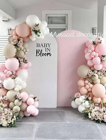 For a soft and elegant baby shower, the 'Baby in Bloom' theme is a beautiful choice. I combine blush, white, and cream balloons with delicate floral arrangements to create a sophisticated and welcoming atmosphere for the mom-to-be.
