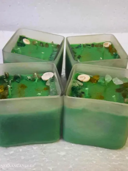 I love the fresh, clean look of these square jar candles. The green wax is infused with crystals and a seashell, bringing a touch of nature's calm indoors.