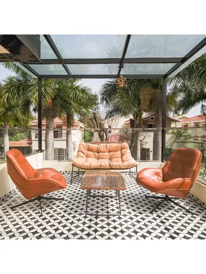 This terrace sit-out is a personalized oasis, designed to enchant. The modern leather seating, geometric floor tiles, and glass roof create a haven of tranquility and style, perfect for every moment spent beneath the open sky.