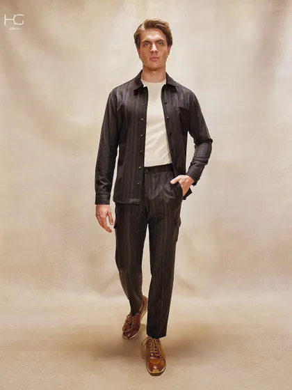 Break the monotony with the effortless appeal of vintage-inspired colors. This striped co-ord set in earthy brown tones offers a look that feels both modern and grounded in heritage.