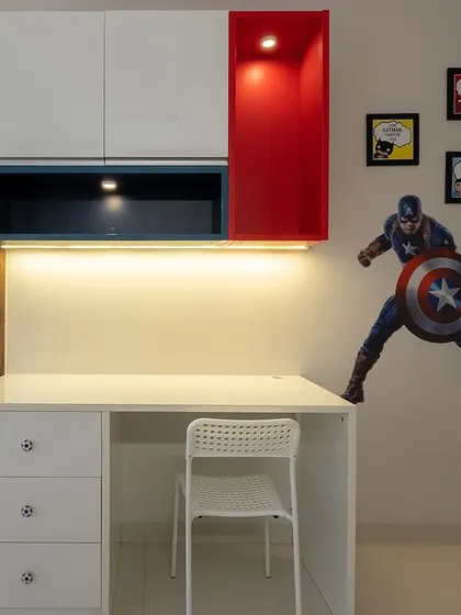 A close-up of the superhero-themed study unit from image 110. The clean design and pops of primary colors make it a fun and engaging space for a child.