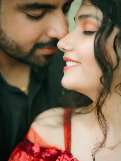 A beautifully artistic close-up focusing on the bride's serene expression and the groom's gentle presence. This shot is all about capturing subtle emotion and connection.