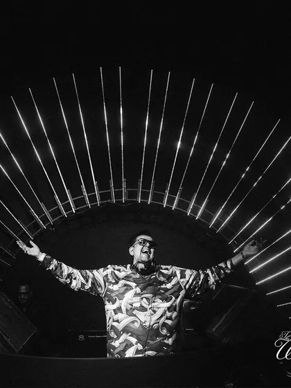The DJ setting the mood for an epic after-party with a stunning light installation as his backdrop.