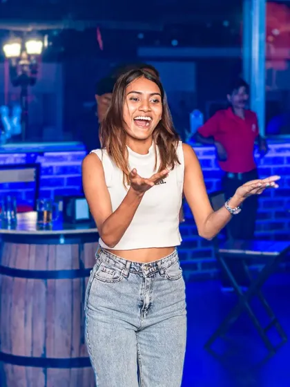 A guest having a blast on the dance floor, showing off her moves. The energy is contagious.