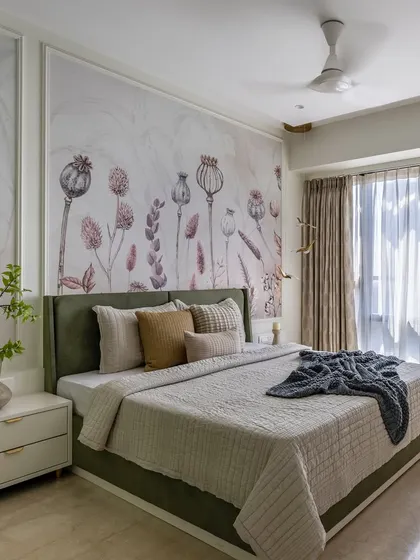 This luxurious master bedroom features a calming palette of beige and sage green. The elegant wall molding and custom botanical wallpaper create a refined focal point, balancing charm with modern style.