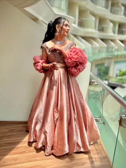 A side view of a bride with a high ponytail, showing how it creates a sleek and elongated silhouette. It's a sophisticated choice for a modern bride.