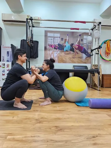 Supporting each other, both in and out of the exercises. Here we are practicing a full squat together.