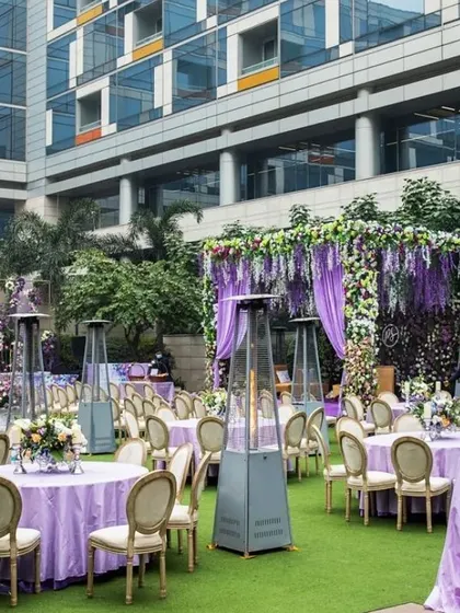 We manage all logistical aspects of your event, including large scale guest seating. This elegant outdoor setup with lavender themed decor and strategically placed heaters ensures guest comfort for a daytime conference or an evening gala dinner.