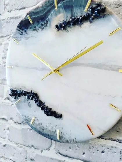 Another angle of this mesmerizing geode clock, showing how the light catches the different textures and colors.