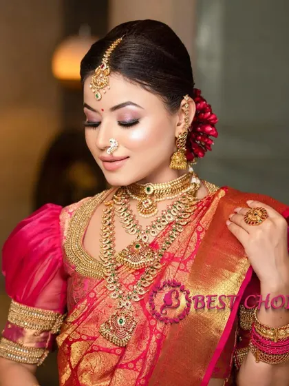 A serene and elegant pose, showing the full effect of the layered necklaces and the beautiful bridal makeup.