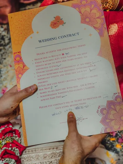 A fun and quirky detail: the "wedding contract" signed by the groom. Capturing these humorous and personal touches is part of telling the unique story of your wedding.