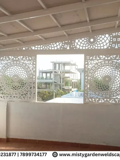 The geometric and floral patterns of the CNC panels create a stunning visual effect, adding a layer of elegance to the terrace design.