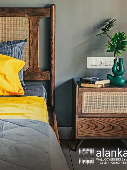 This bedroom set showcases the beauty of natural materials. The bed's headboard and matching bedside table are crafted from solid wood with intricate cane weaving, creating a timeless and elegant look.
