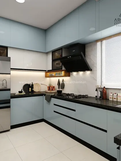 A contemporary kitchen with light blue cabinets and a black granite countertop. The design is clean and efficient, with ample storage and workspace.