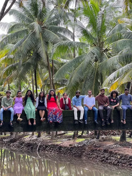 A group photo on a coconut log bridge.