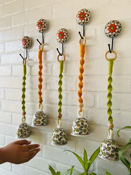 A beautiful set of our macrame ceramic bells in a combination of evergreen and orange. You can customize your set by choosing your favorite colors to match your home's aesthetic.