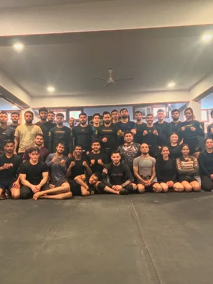 The aftermath of a tough Saturday fight training session. Exhausted bodies, but strong spirits. This is the look of a team that has given its all.