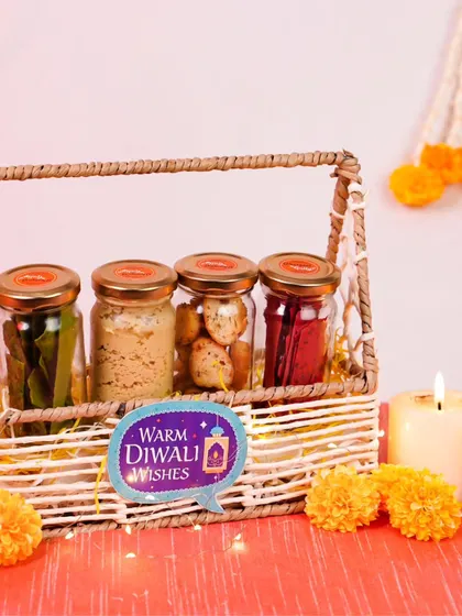 This wicker basket hamper is filled with four jars of assorted gourmet goodies, including savory snacks, cookies, and mouth fresheners. It's a simple, elegant, and delicious gift for the festive season.