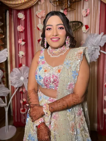 A close-up of the bride, her makeup perfectly matching the playful vibe of her outfit.