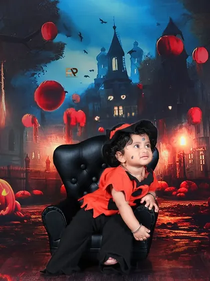 A baby in a Halloween costume looks up, surrounded by a spooky, atmospheric backdrop. This shot captures the wonder and excitement of a child's first Halloween.