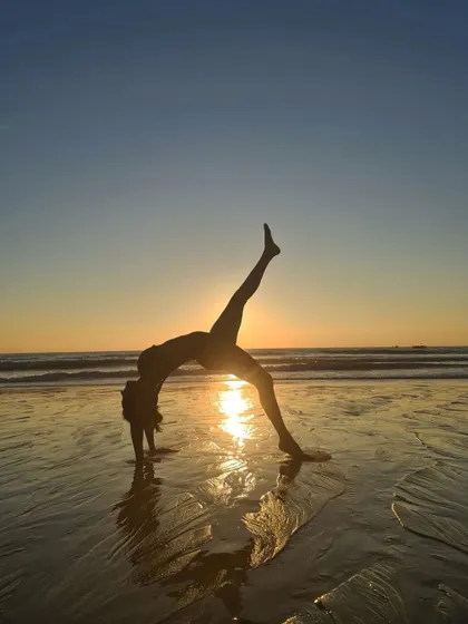 A moment of peace and connection at sunset. This variation of Wild Thing on the beach is a reminder that yoga is a practice we can take anywhere. It’s about bending so you don’t break, finding flexibility not just in the body, but in the mind and spirit too.