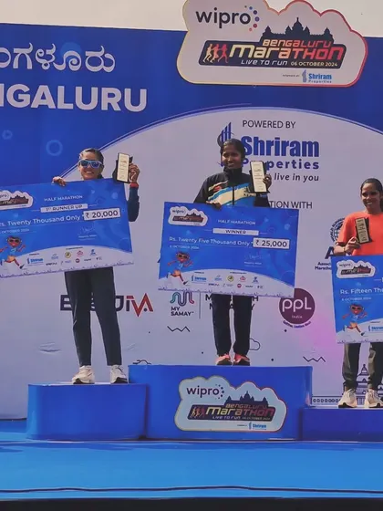 On the podium at the Wipro Bengaluru Marathon. Securing a second-place finish as the fastest female in the half marathon category is a proud moment.