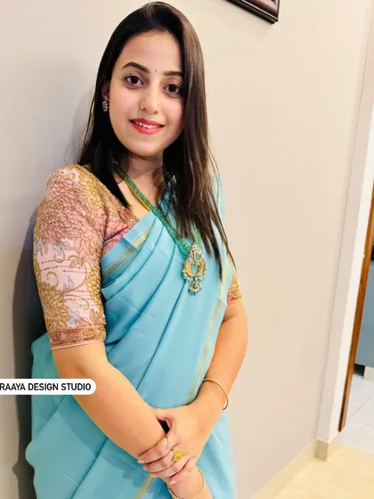 Soundarya in a beautiful light blue saree. Her custom blouse features intricate embroidery on the sleeves, adding a touch of elegance and detail.